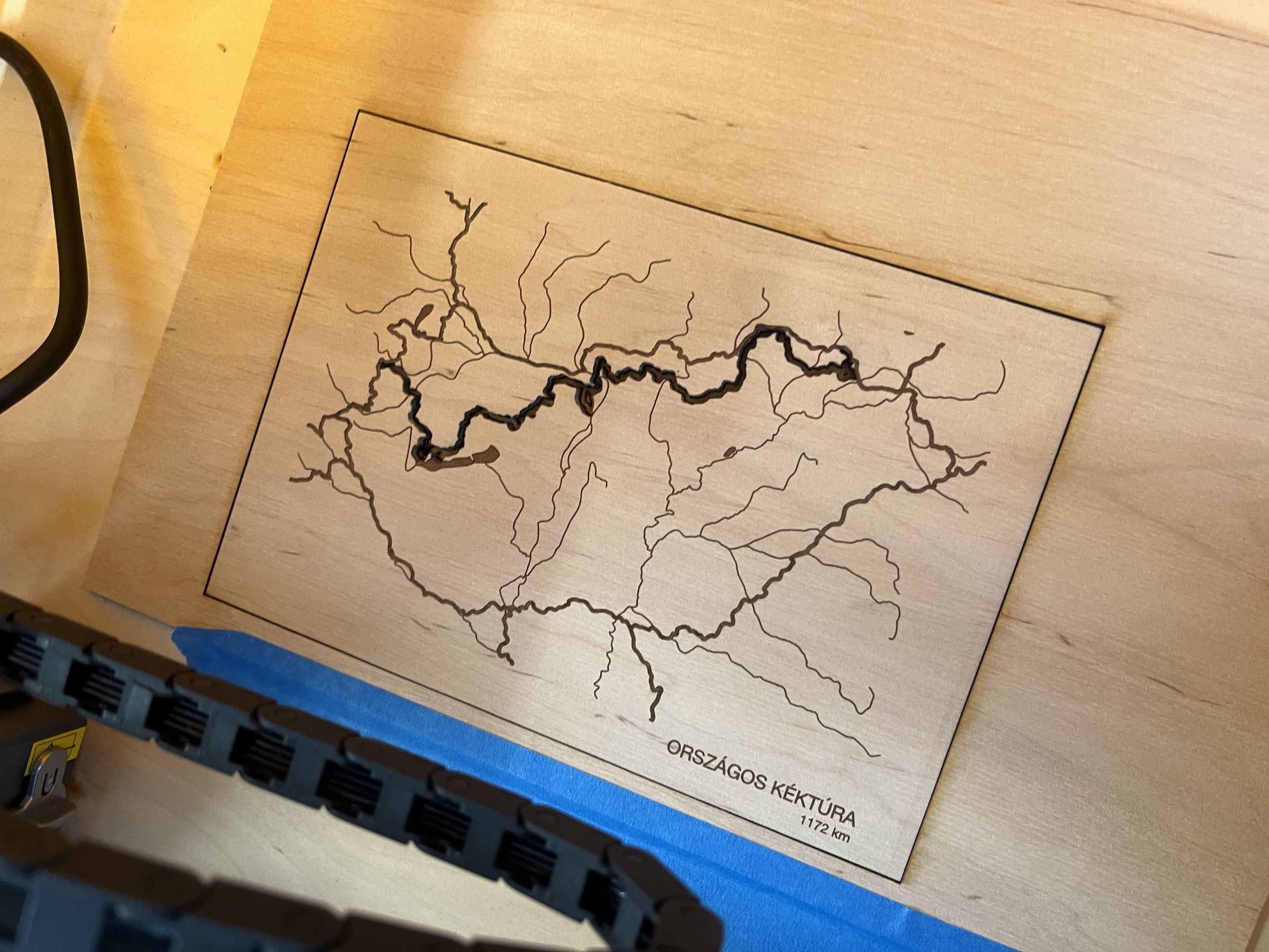 The laser-engraved plywood cover