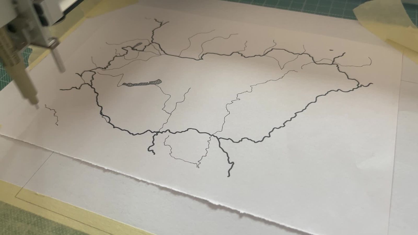 Pen plotter drawing the trail map